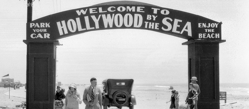 Old photo (1930s?): Park Your Car - Welcome to Hollywood by the Sea - Enjoy the Beach